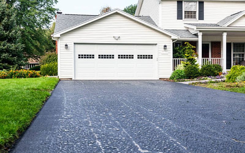 14. Fo╠erla╠engning av garageuppfart nya buskar